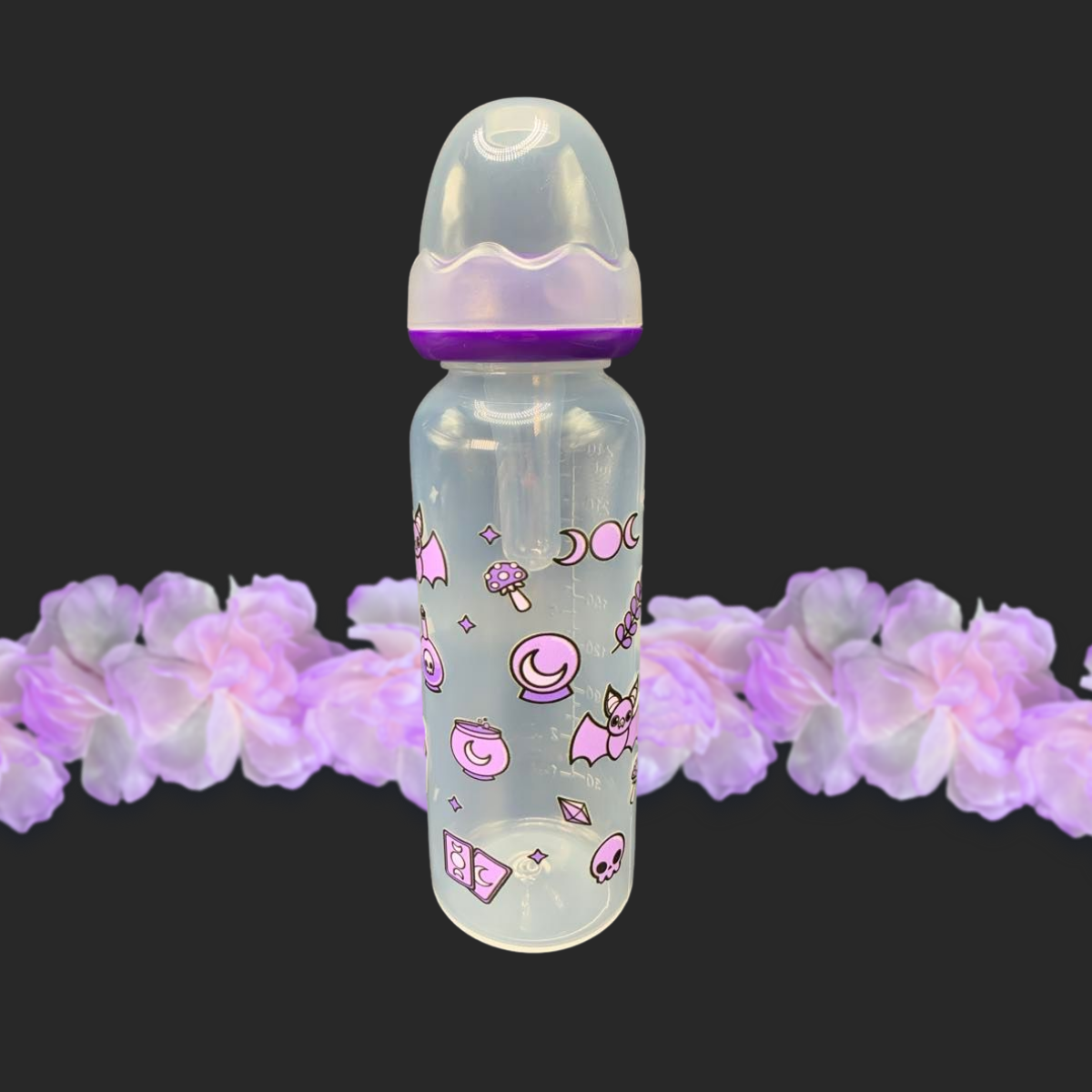 An 8oz adult baby bottle with a purple witch theme, featuring magical designs like bats, tarot cards, potions, stars, and moons wrapping around the bottle for a whimsical and enchanting look.