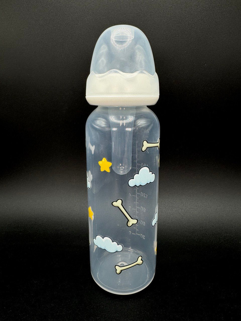 Nighttime dog-themed adult baby bottle featuring a wrap-around design of dog bones, fluffy clouds, and twinkling stars, creating a cozy and comforting aesthetic.