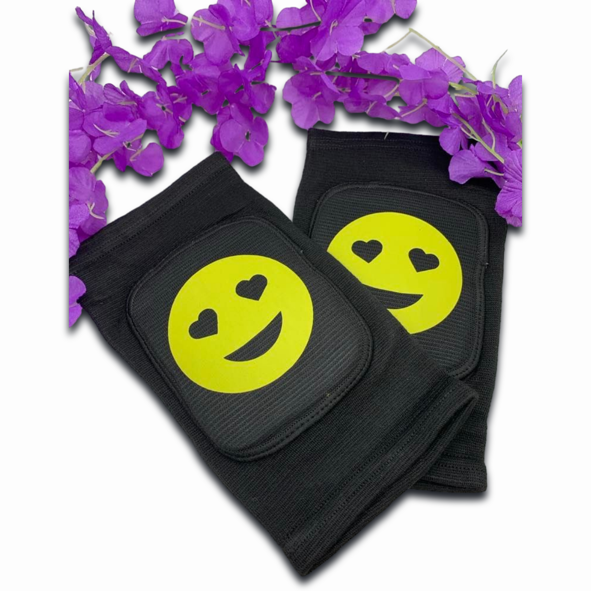 Adult knee pads featuring a cheerful smiley face emoji in the center for a cute and playful appearance.
