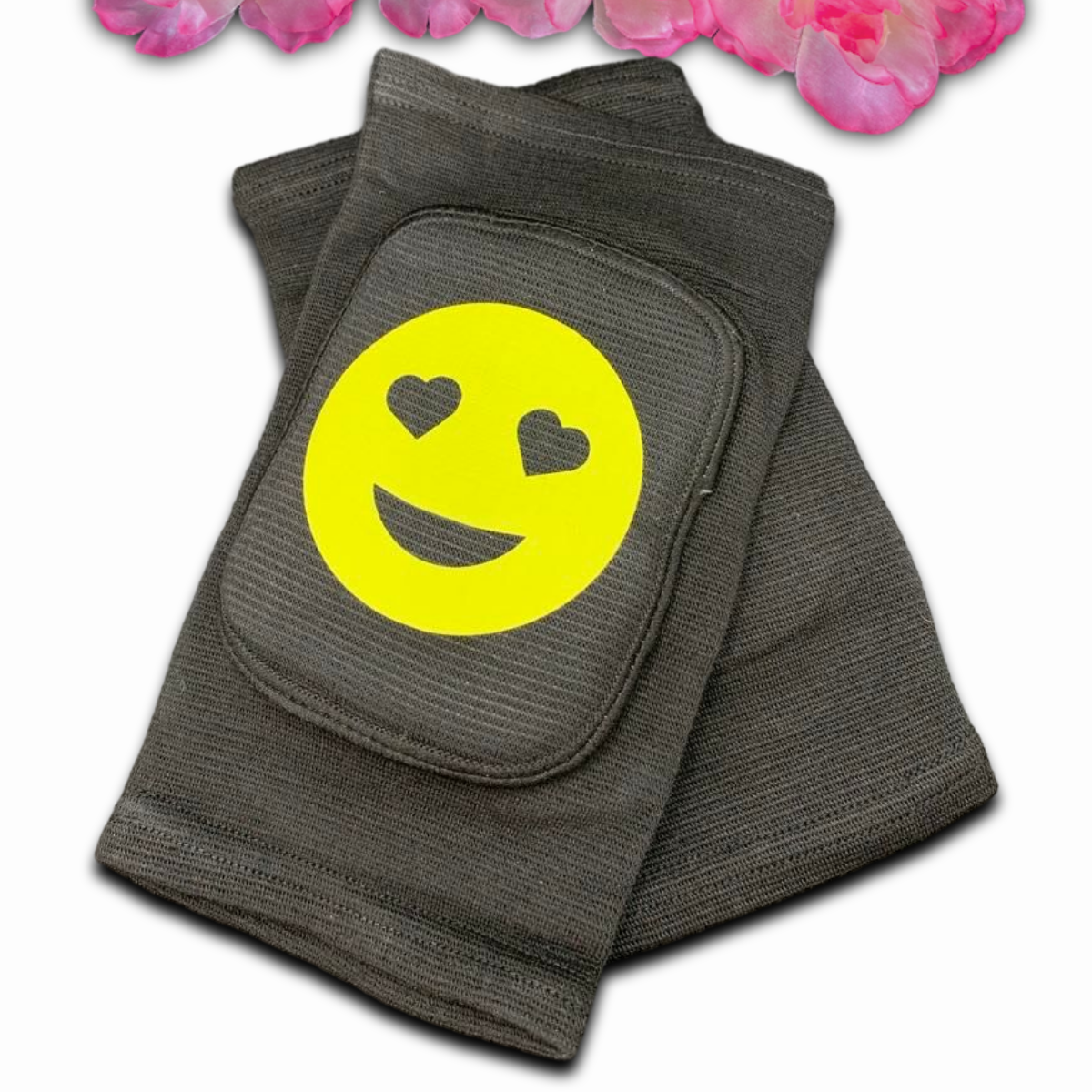 ABDL adult knee pads styled like baby knee pads, featuring a cheerful smiley face emoji in the center for a cute and playful appearance.