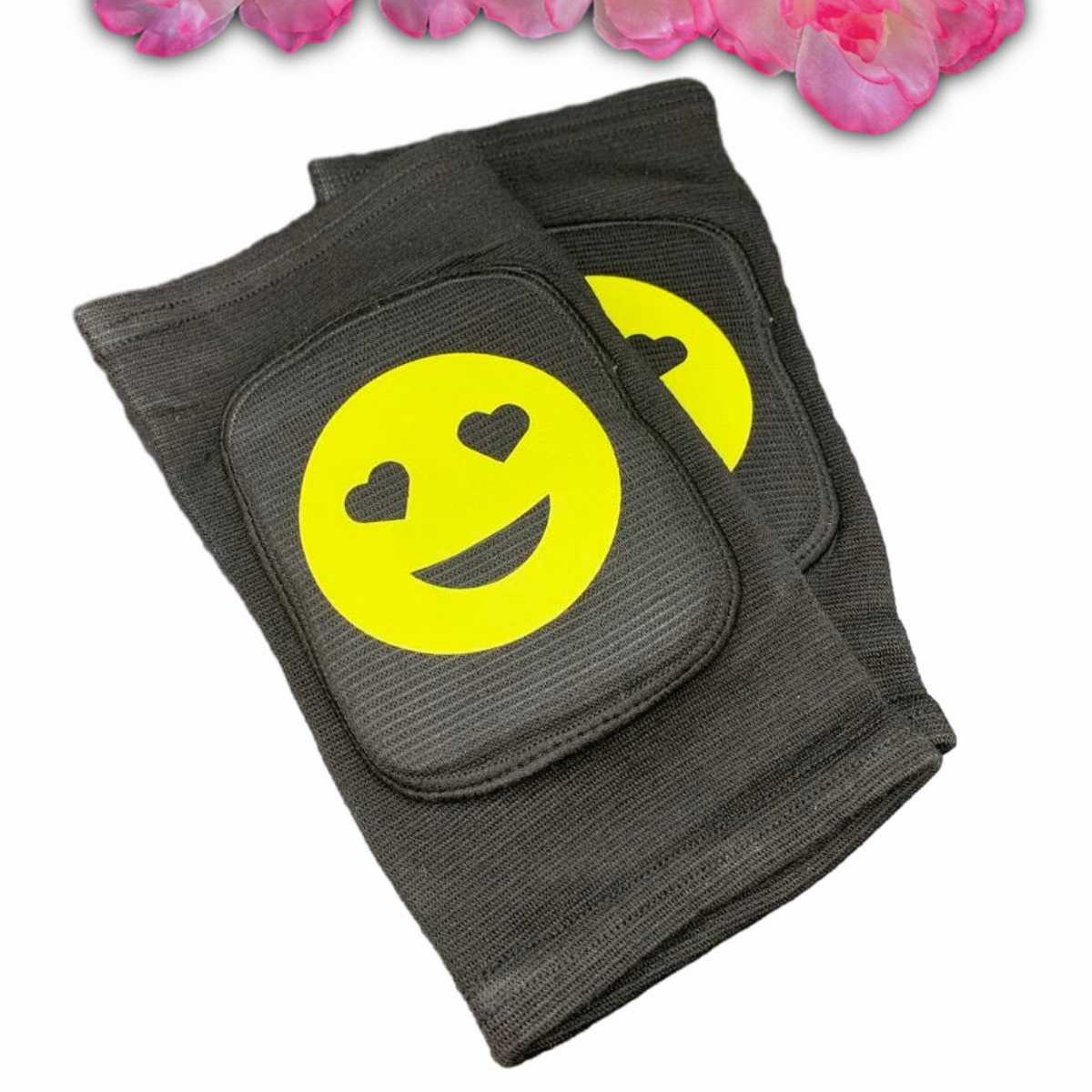 Adult knee pads featuring a cheerful smiley face emoji in the center for a cute and playful appearance.