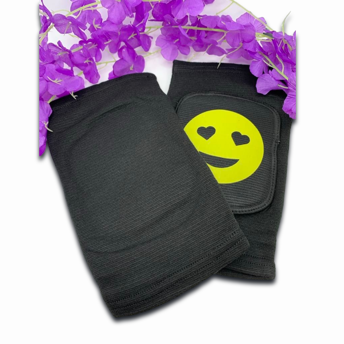 Adult knee pads featuring a cheerful smiley face emoji in the center for a cute and playful appearance.