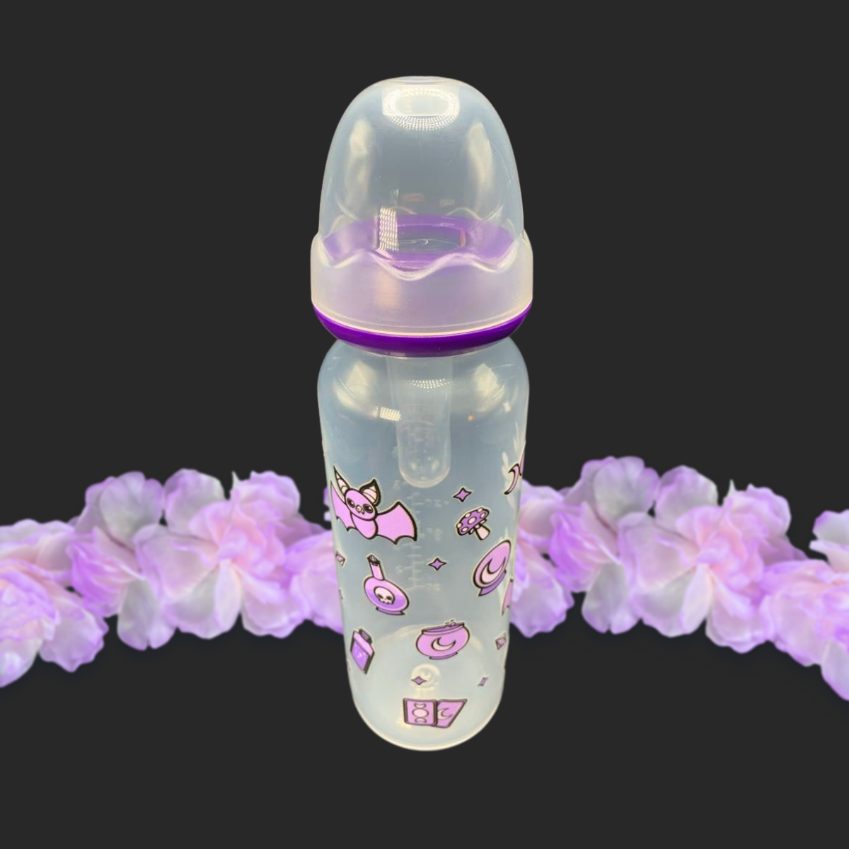 An 8oz adult baby bottle with a purple witch theme, featuring magical designs like bats, tarot cards, potions, stars, and moons wrapping around the bottle for a whimsical and enchanting look.