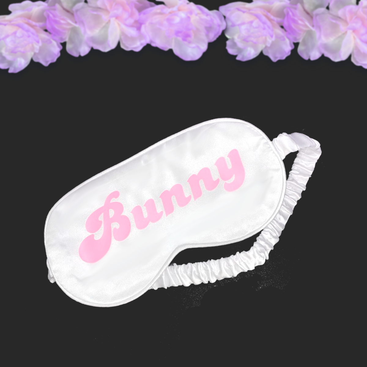 white blindfold silk mask with pink text saying Bunny