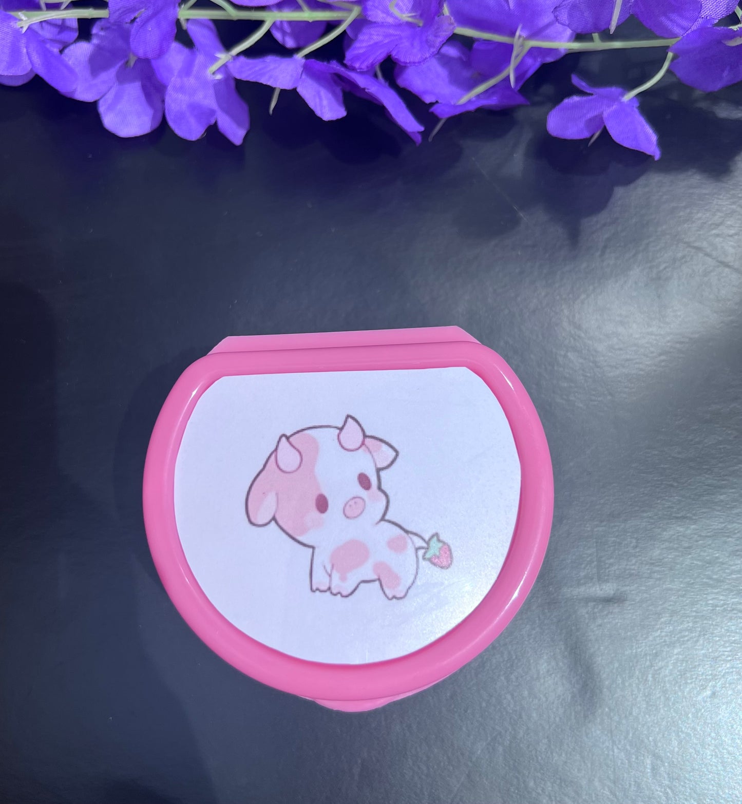 Strawberry cow-themed adult pacifier case featuring a cute pink and white design with strawberry accents, perfect for storing and protecting pacifiers in style.