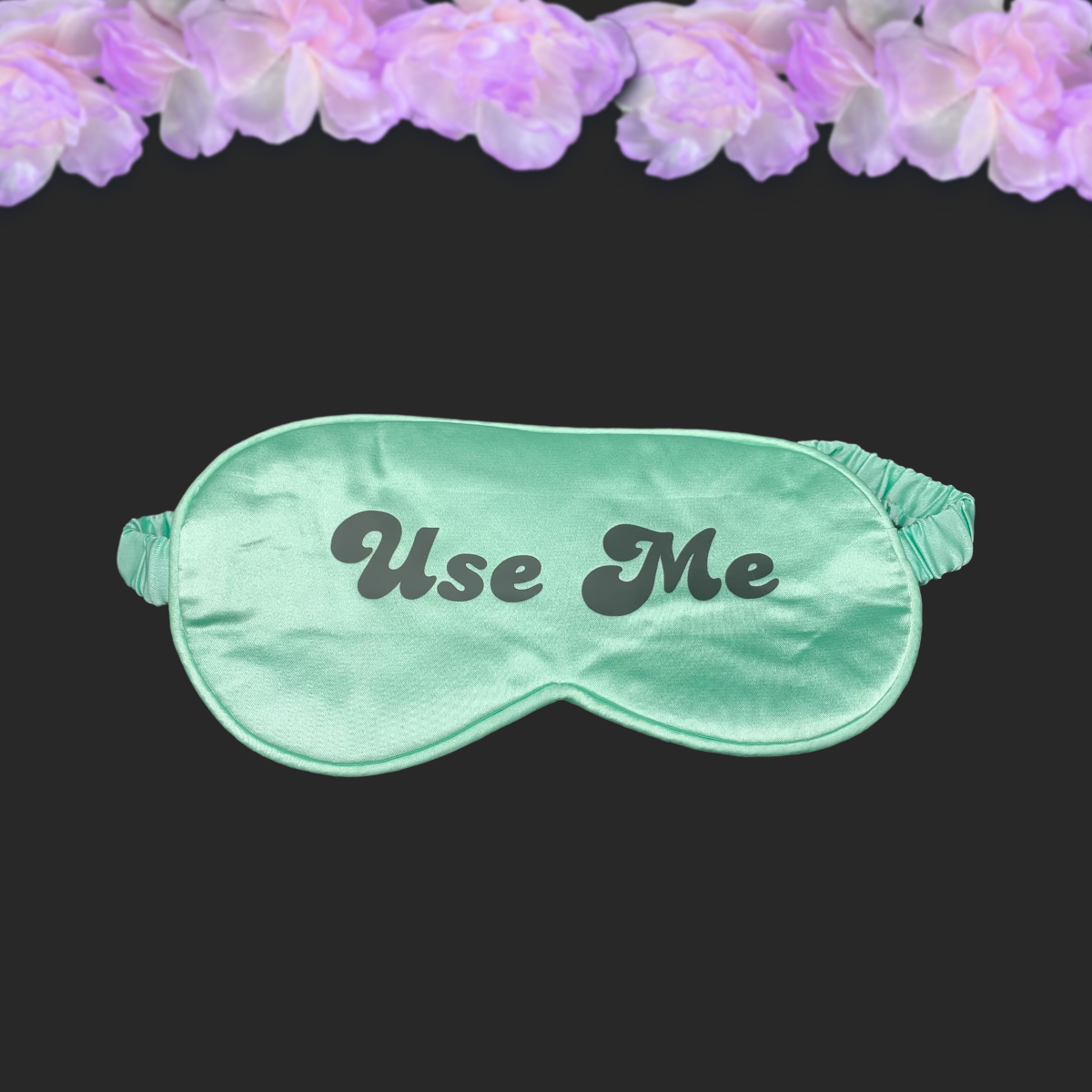 green mint silk sleep mask with black text reading Use Me