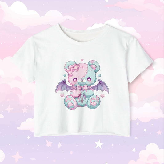 Kawaii pastel punk crop top featuring a cute yet edgy bear with bat wings design with soft pastel tones and punk-inspired details, perfect for little space and alternative fashion.