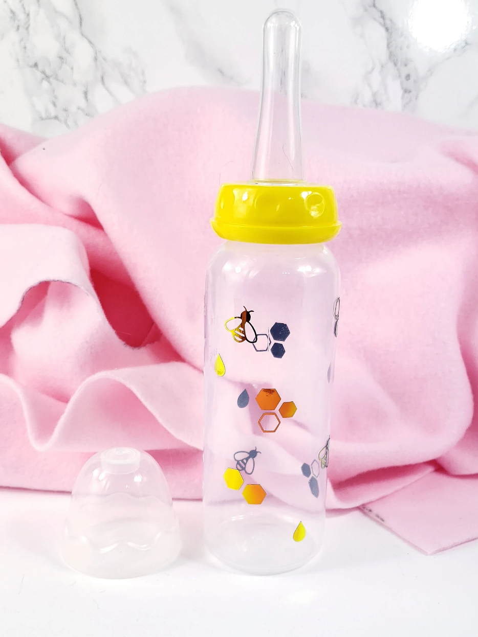 An 8oz ABDL bottle featuring a cheerful bee theme, with cute bees, honeycombs, and vibrant honey gold accents wrapping around the bottle for a playful and whimsical design.