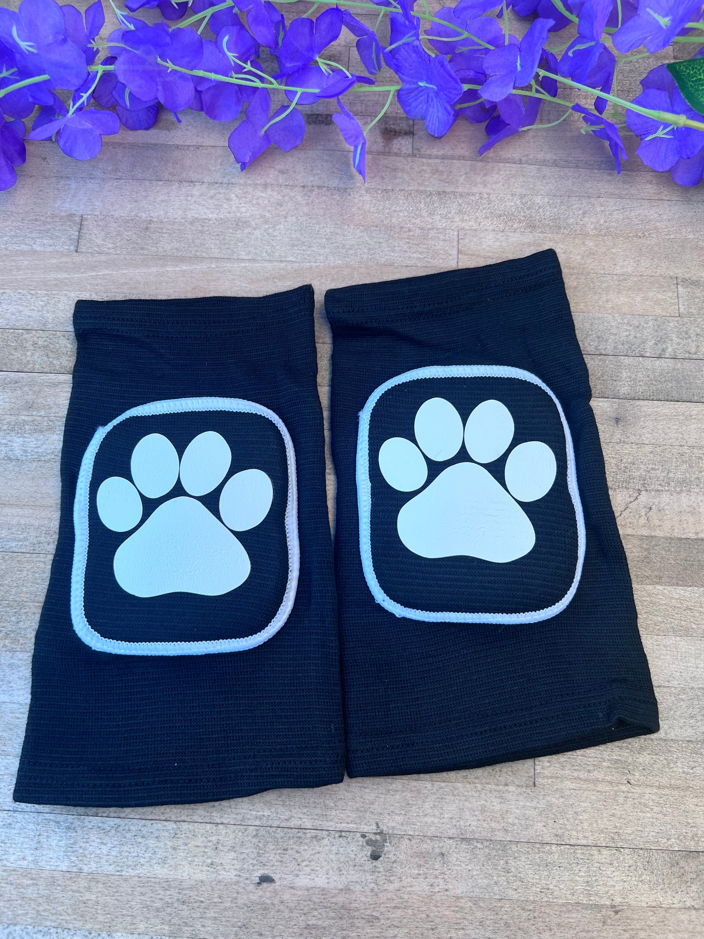 Adult knee pads featuring a cozy design with a paw print on each knee, perfect for pet play or adding a cute animal-themed touch.