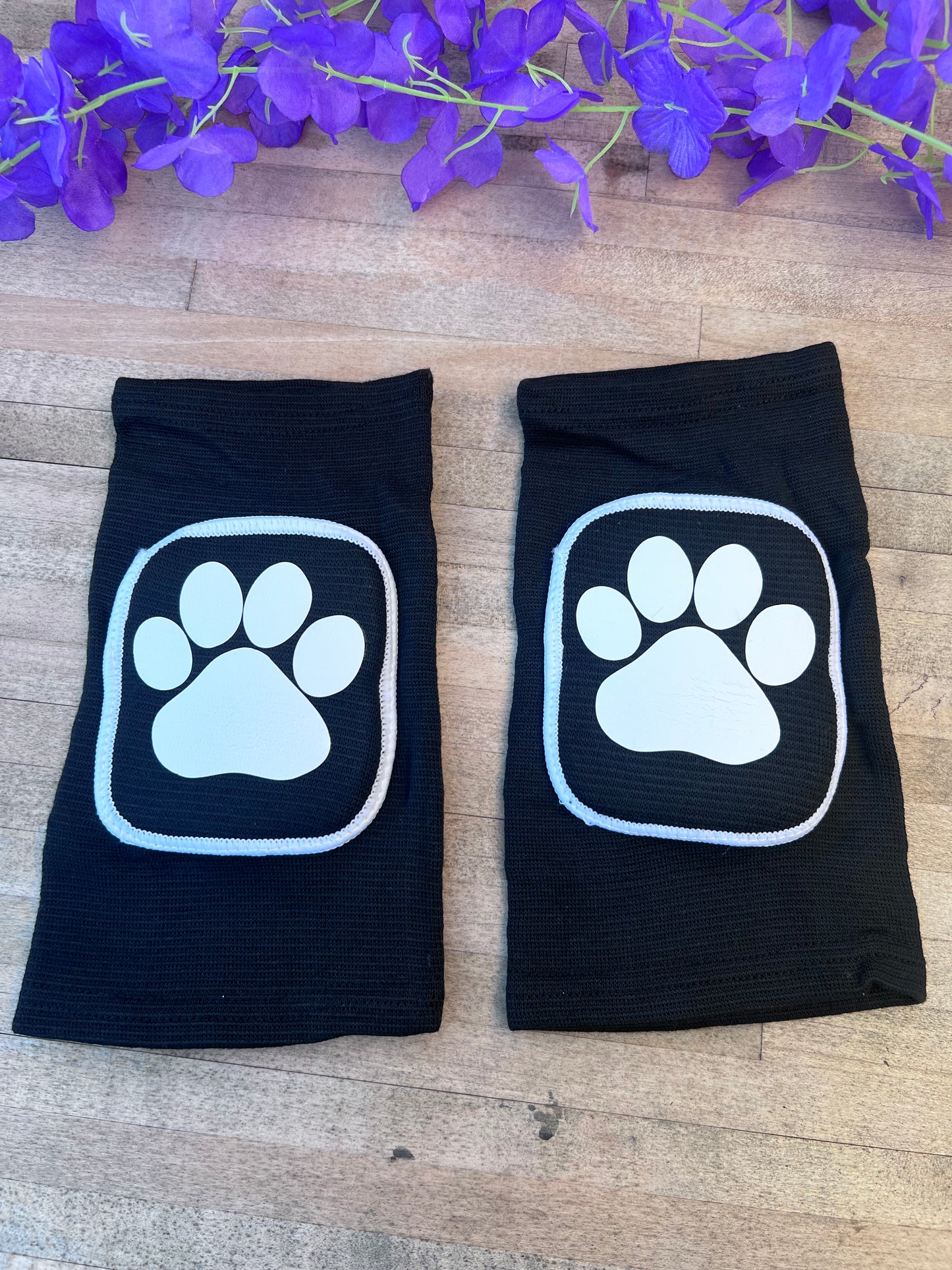 Adult knee pads featuring a cozy design with a paw print on each knee, perfect for pet play or adding a cute animal-themed touch.