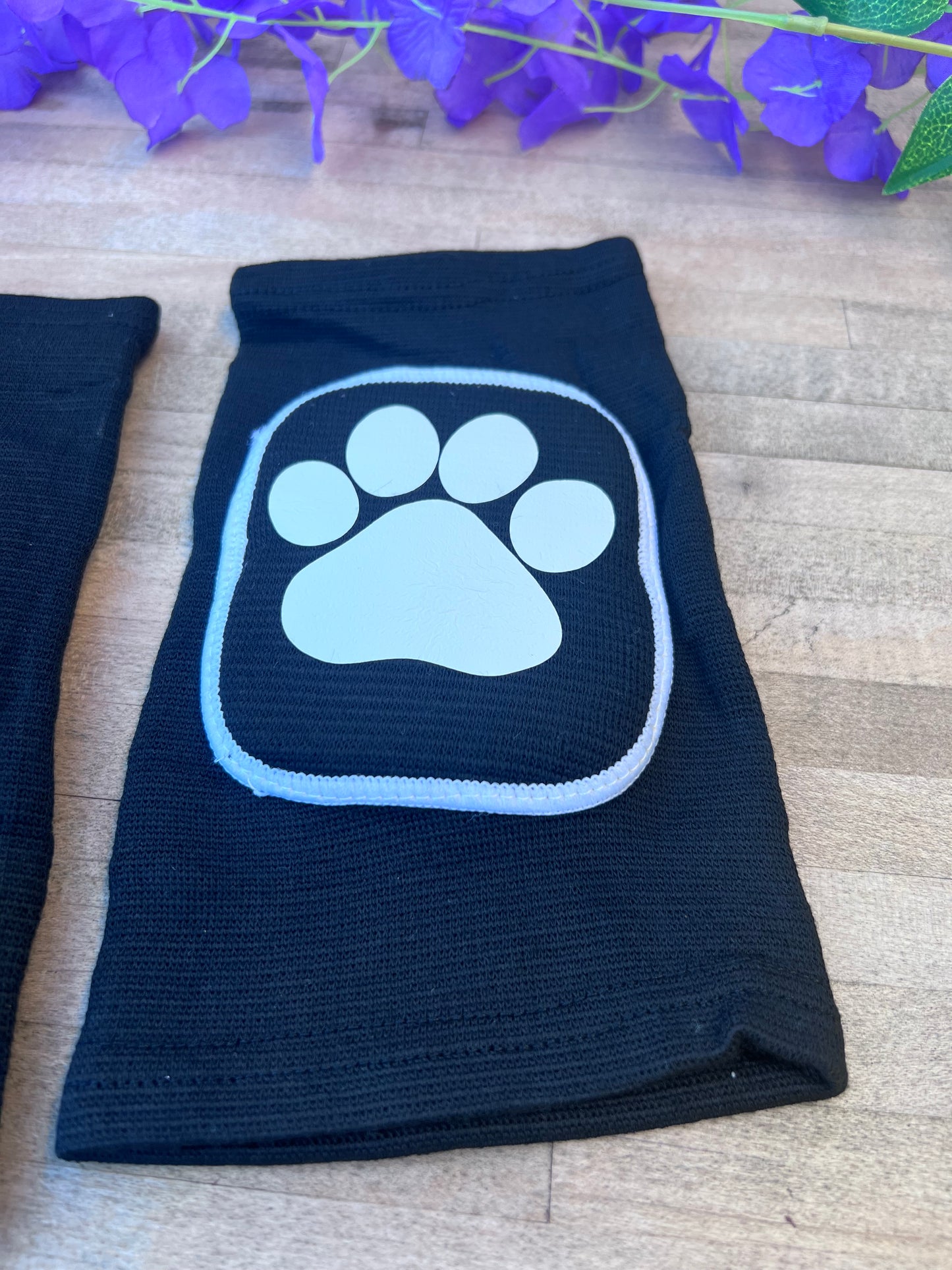 Adult knee pads featuring a cozy design with a paw print on each knee, perfect for pet play or adding a cute animal-themed touch.