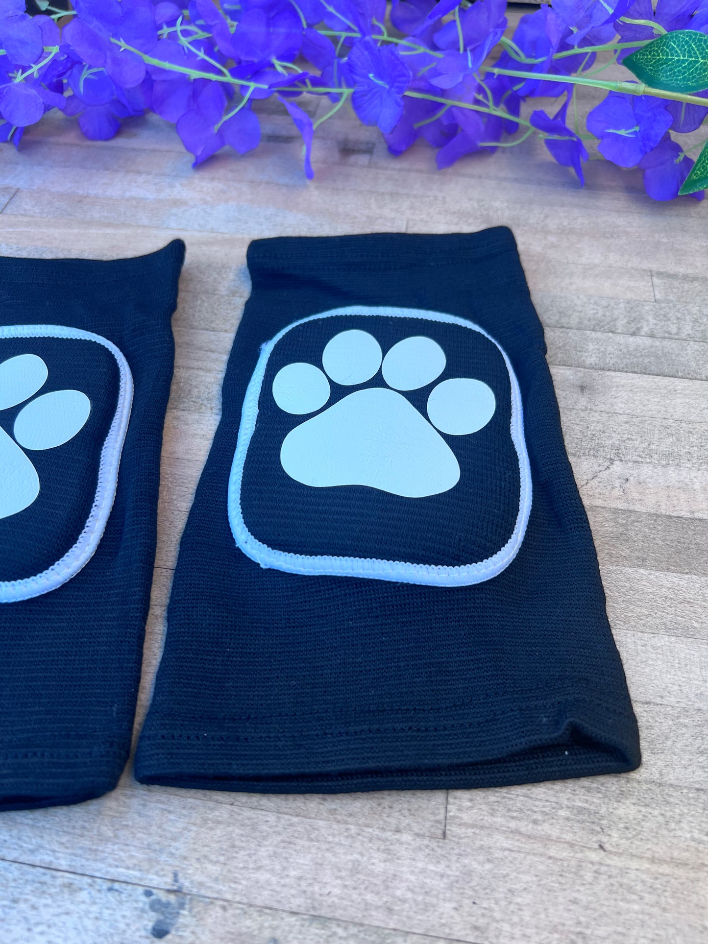 Adult knee pads featuring a cozy design with a paw print on each knee, perfect for pet play or adding a cute animal-themed touch.