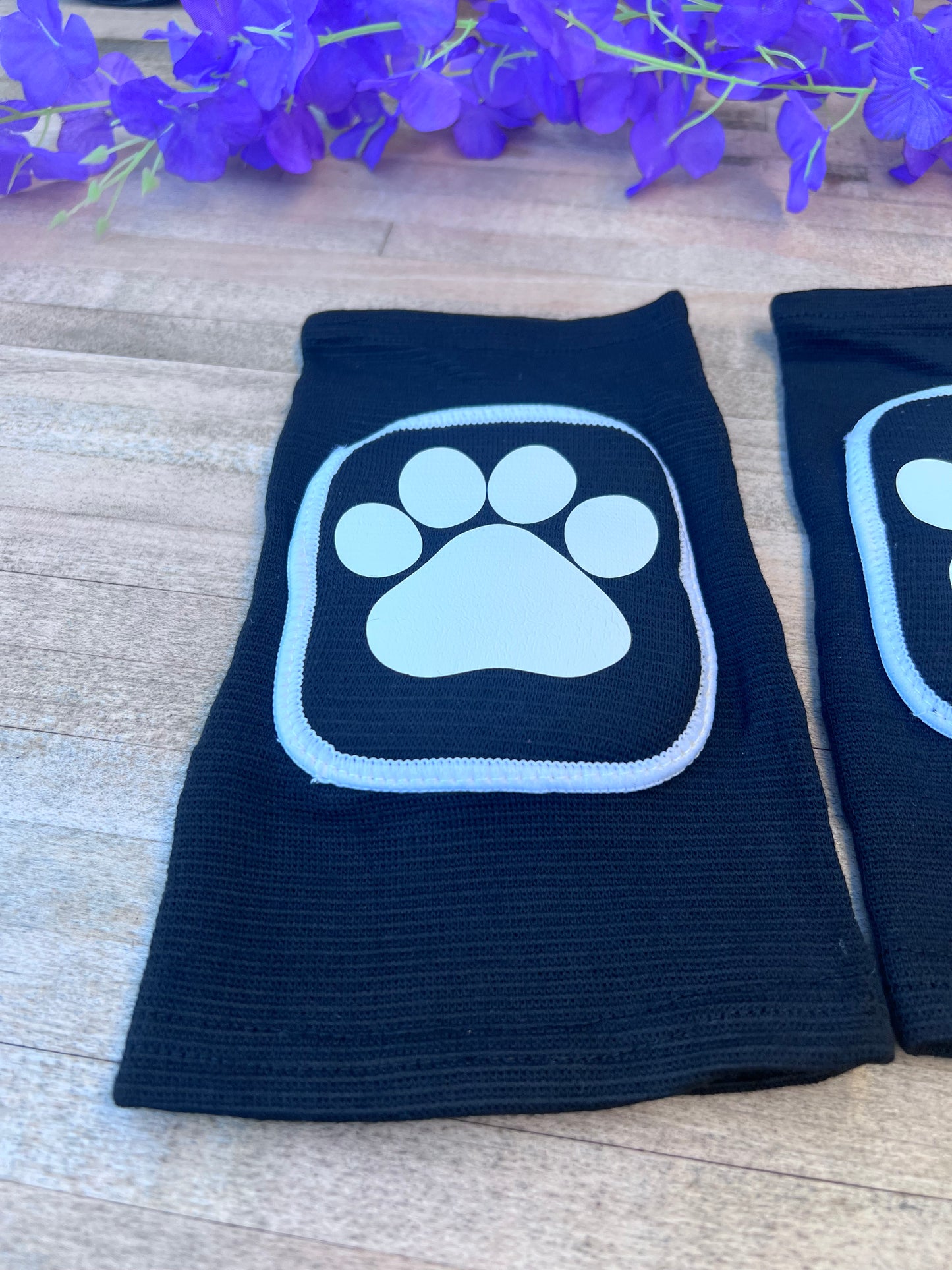 Adult knee pads featuring a cozy design with a paw print on each knee, perfect for pet play or adding a cute animal-themed touch.