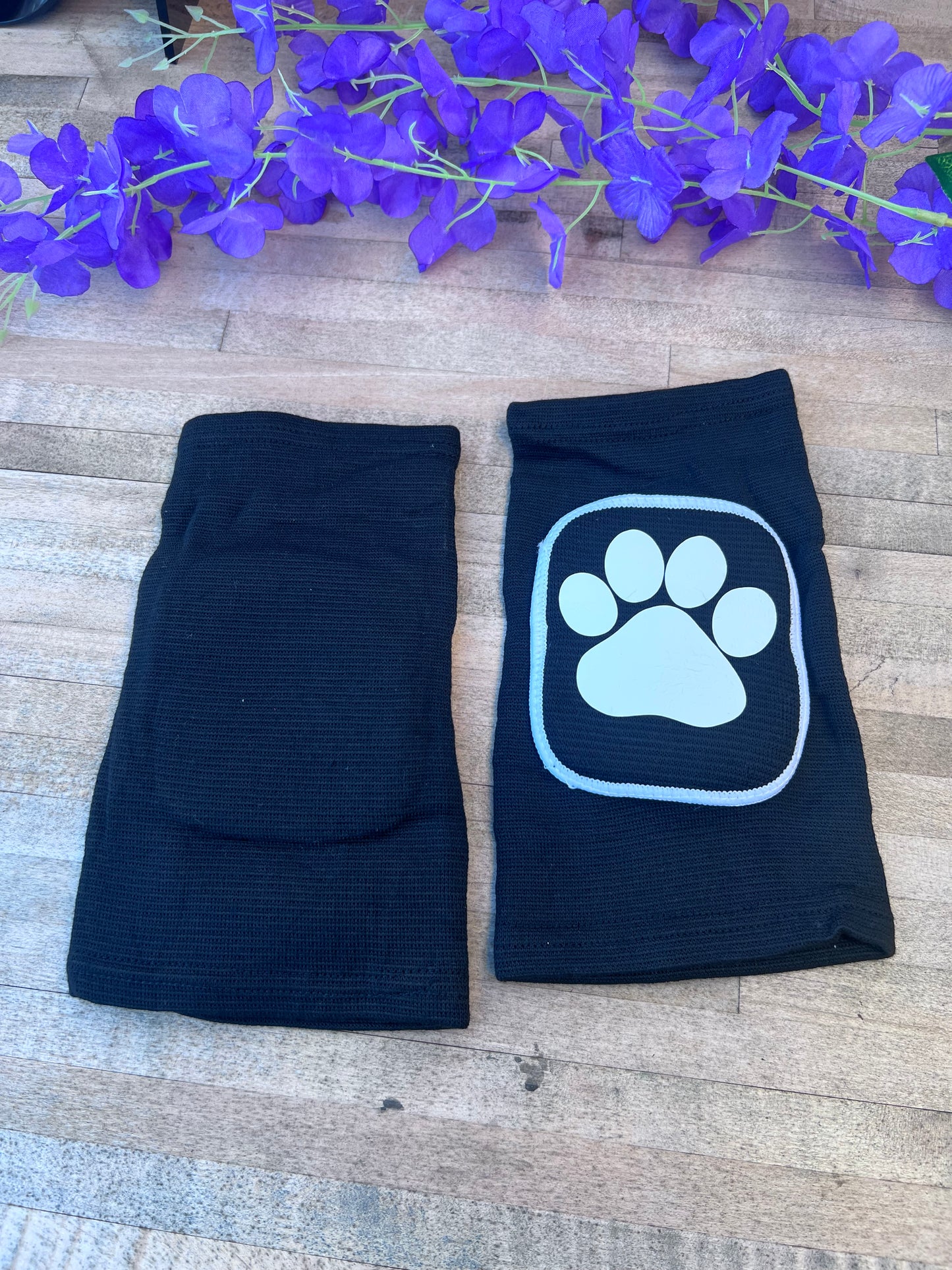 Adult knee pads featuring a cozy design with a paw print on each knee, perfect for pet play or adding a cute animal-themed touch.