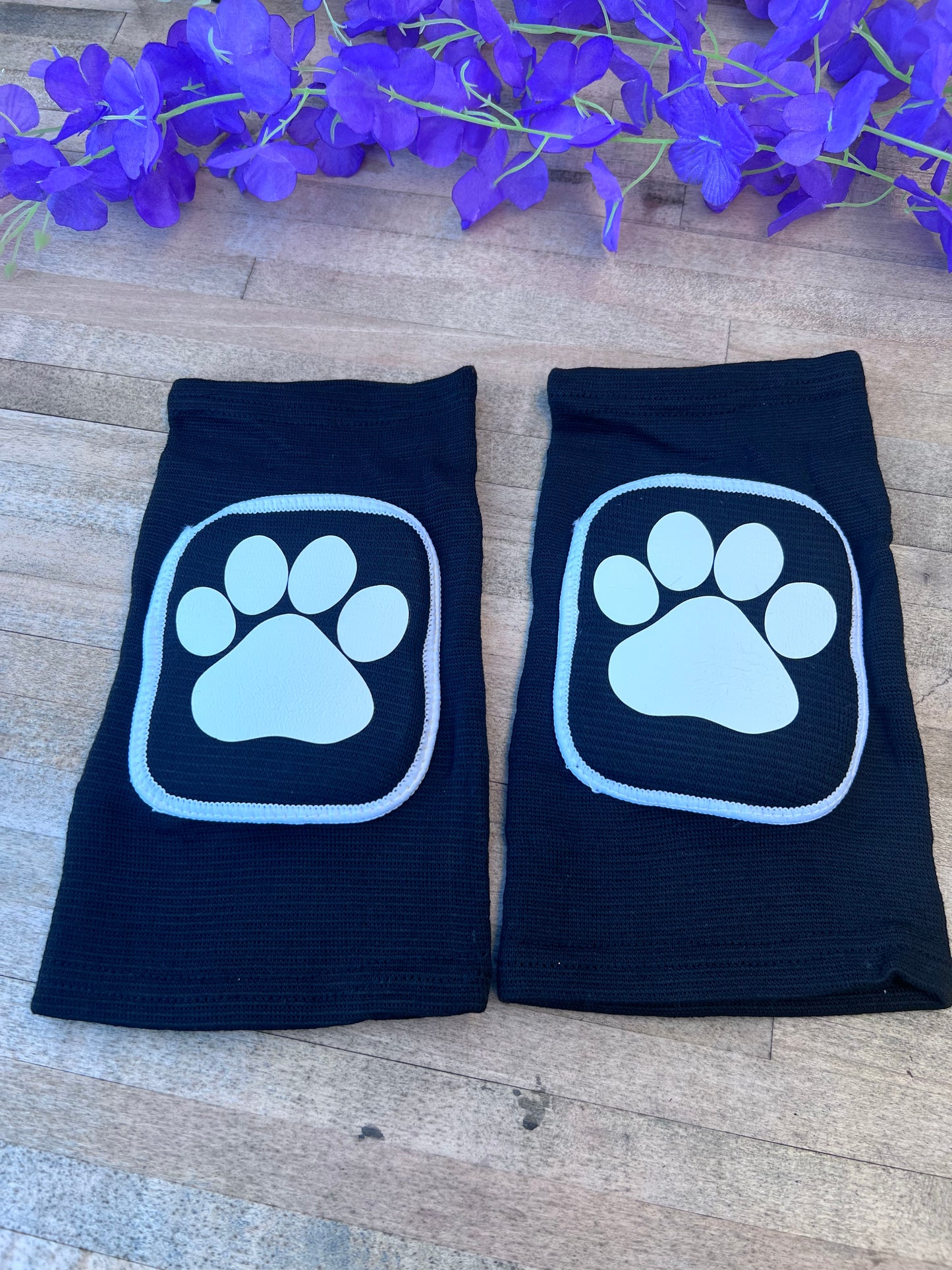 Adult knee pads featuring a cozy design with a paw print on each knee, perfect for pet play or adding a cute animal-themed touch.