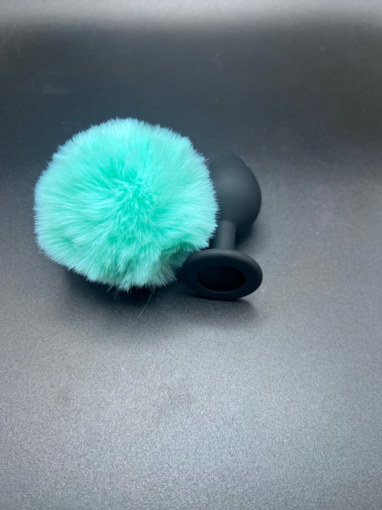 black anal plug with teal bunny tail that comes apart for easy cleaning
