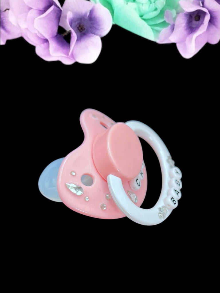 Cry Baby adult deco pacifier featuring a decorative diamond gem design on the shield and handle, adding a stylish and playful touch.