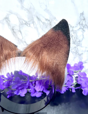 Fox cosplay ears featuring soft, fluffy fur and a realistic design, perfect for adding a playful and foxy touch to any costume or outfit."
