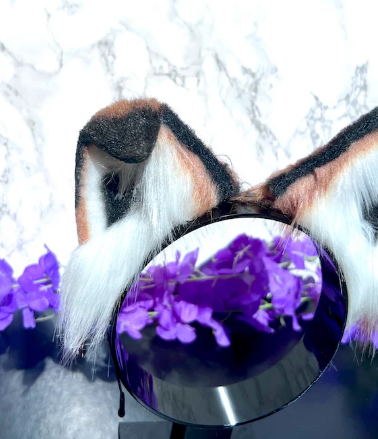 Fox cosplay ears featuring soft, fluffy fur and a realistic design, perfect for adding a playful and foxy touch to any costume or outfit."