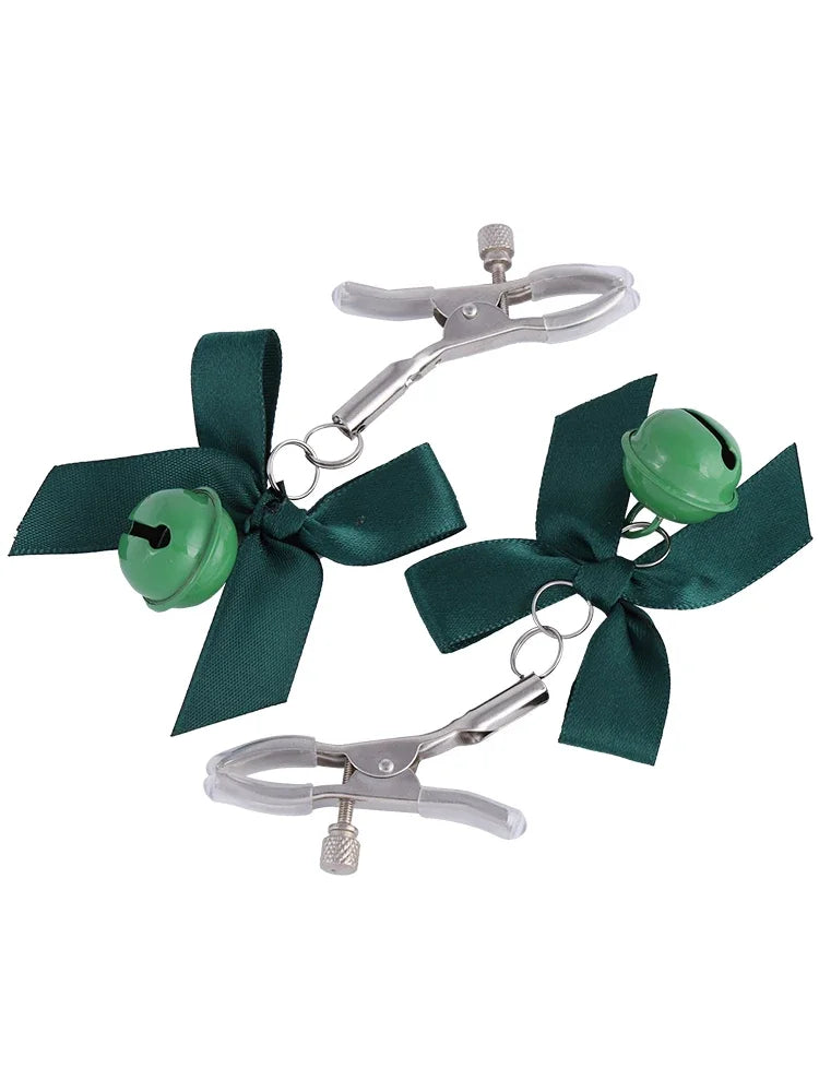 Stainless steel nipple clamps with green attached bows and bells at the ends, featuring a silicone cover for added comfort and a stylish, playful touch.