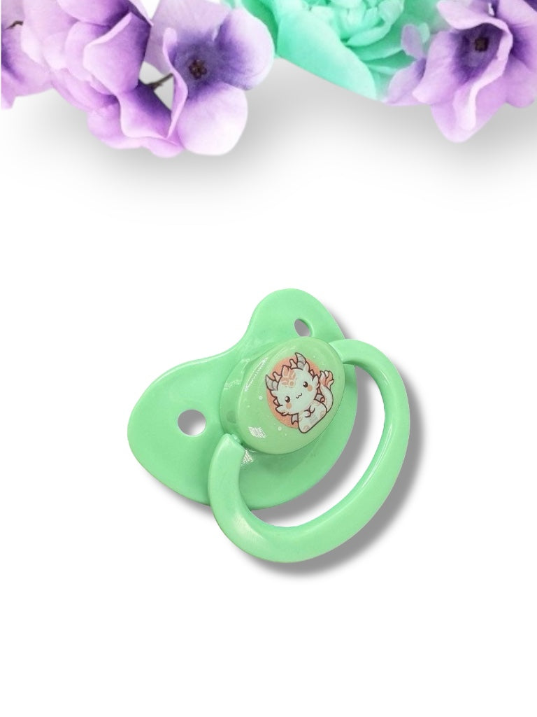 Adult pacifier featuring a Japanese-style dragon in white and red on the center button, combining traditional art with a bold and mystical design."