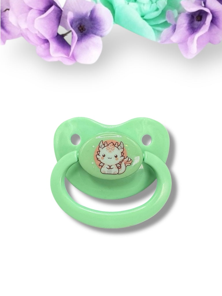 Adult pacifier featuring a Japanese-style dragon in white and red on the center button, combining traditional art with a bold and mystical design.
