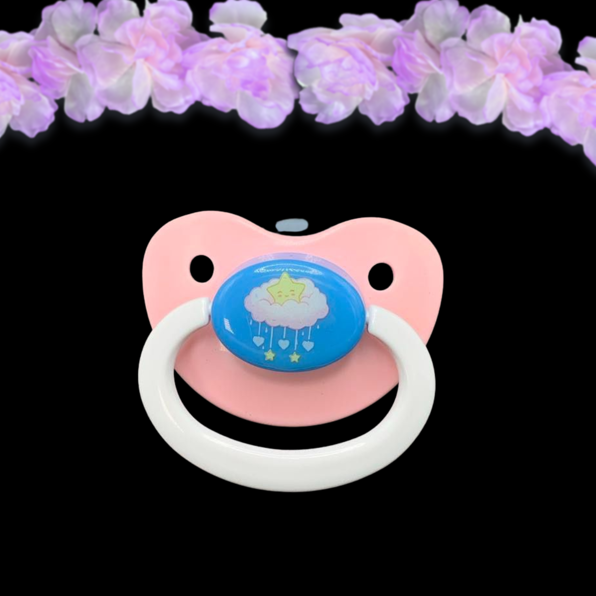 Adult dummy pacifier in baby pink, baby blue and baby white with center image of kawaii star sitting on a cloud with dangling hearts and stars like a mobile