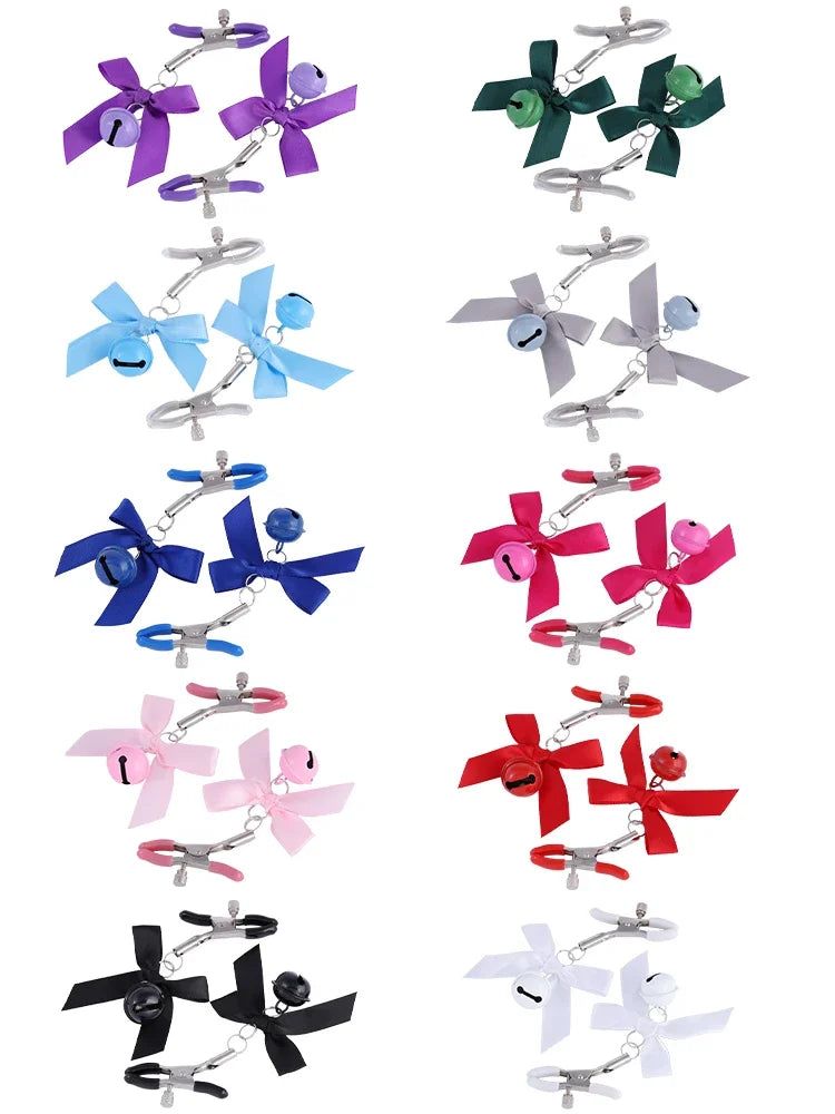 Stainless steel nipple clamps with attached bows and bells at the ends, featuring a silicone cover for added comfort and a stylish, playful touch.