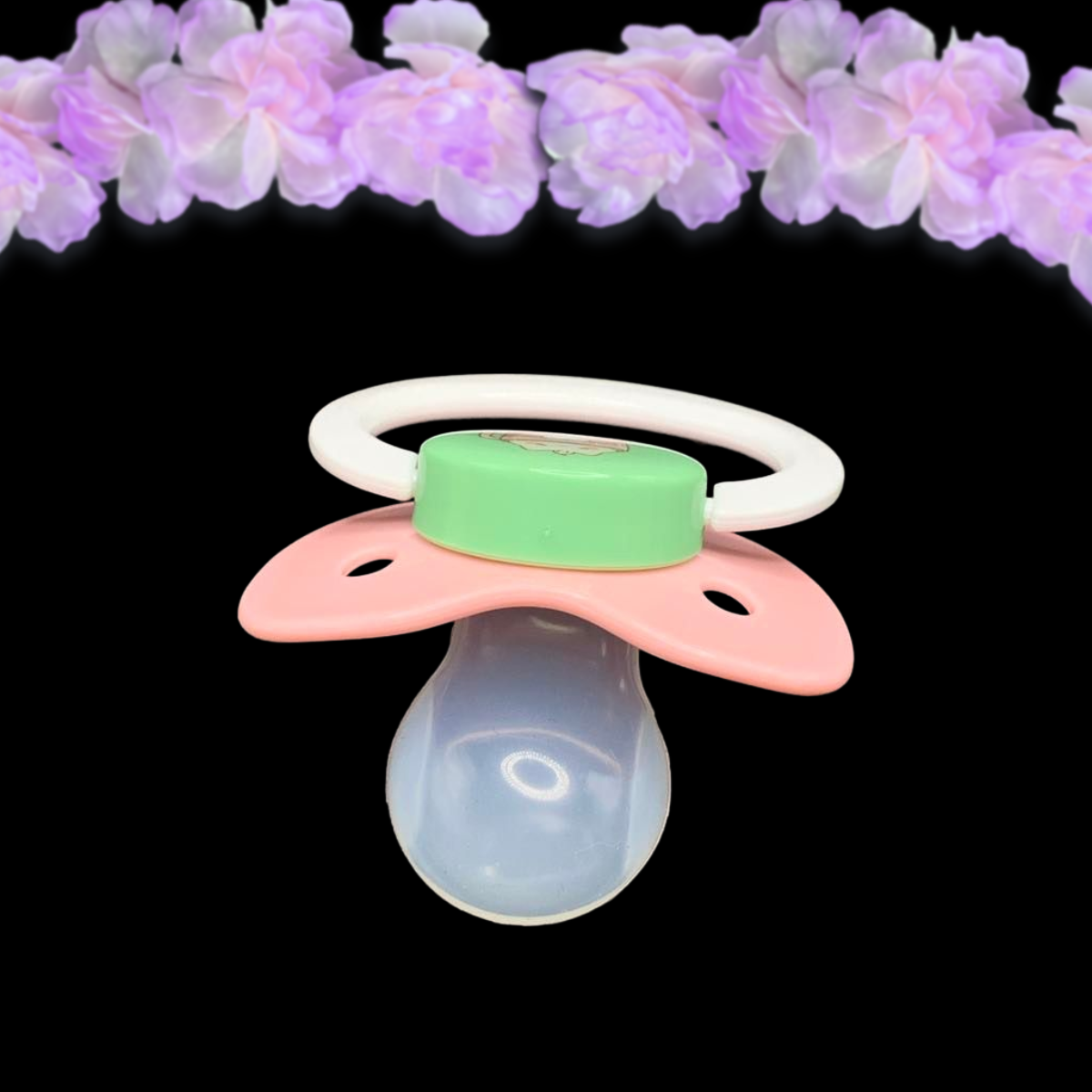 top view of adult pacifier showing shape of the clear reinforced pacifier nipple