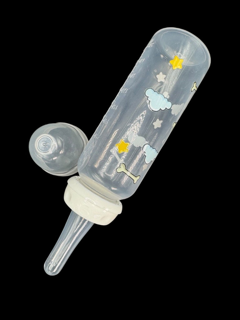 Nighttime dog-themed adult baby bottle featuring a wrap-around design of dog bones, fluffy clouds, and twinkling stars, creating a cozy and comforting aesthetic.