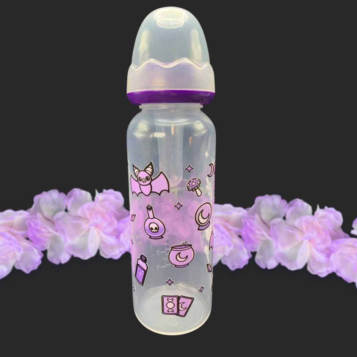 An 8oz adult baby bottle with a purple witch theme, featuring magical designs like bats, tarot cards, potions, stars, and moons wrapping around the bottle for a whimsical and enchanting look.