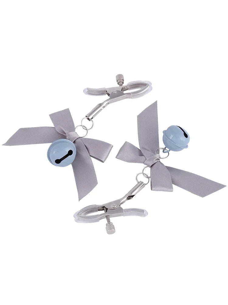 Stainless steel nipple clamps with gray attached bows and bells at the ends, featuring a silicone cover for added comfort and a stylish, playful touch.