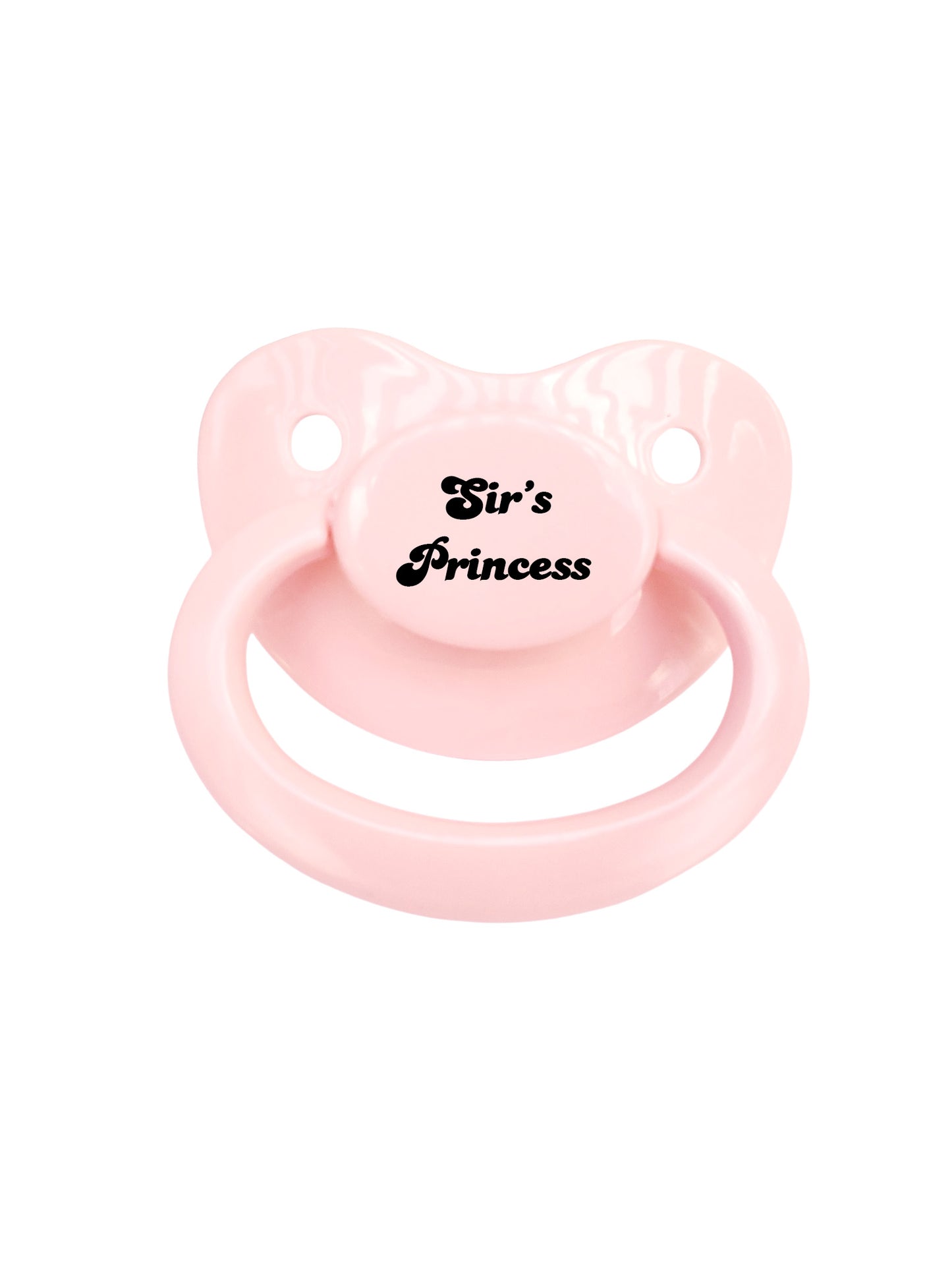 A pink adult pacifier with the phrase 'Sir's Princess' printed on the button.