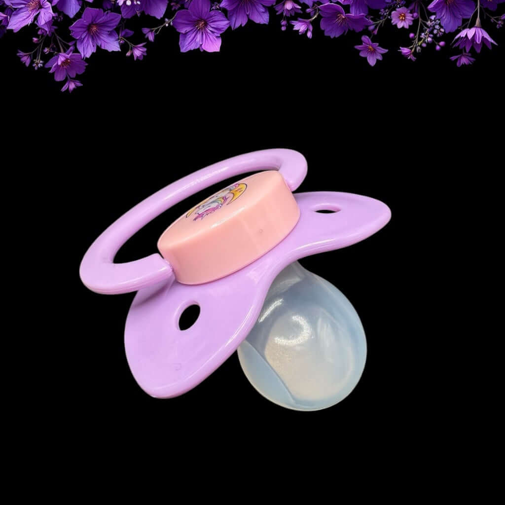 Enjoy our adorable adult pacifier featuring a Kawaii unicorn sitting on the moon in the center with the option to add your own custom text to the handle.