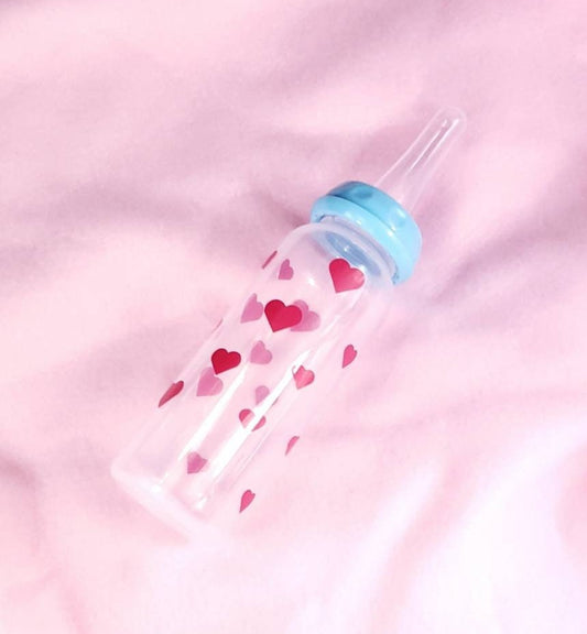 An 8oz adult baby bottle featuring a sweet design with pink hearts scattered around, creating a playful and loving theme.