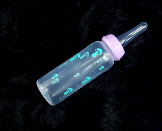 An 8oz adult baby bottle featuring a whimsical design with teal mushrooms scattered around, creating a magical and nature-inspired theme.