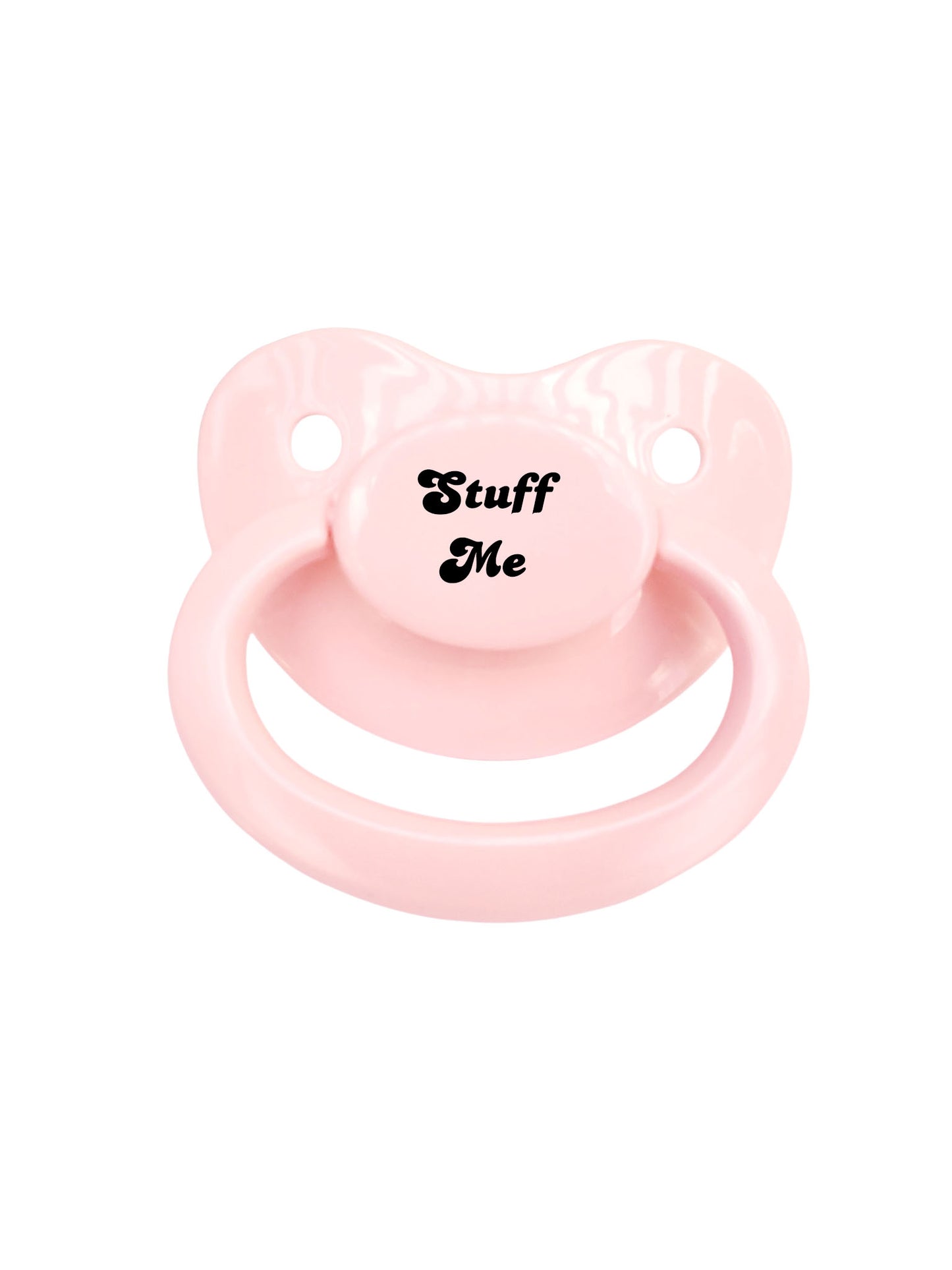baby pink adult pacifier with the text "Stuff Me" in the center