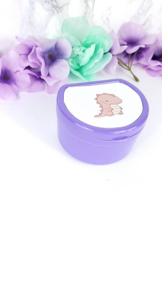 ABDL pacifier case featuring a cute red dinosaur design on the lid, adding a fun and playful touch to pacifier storage.