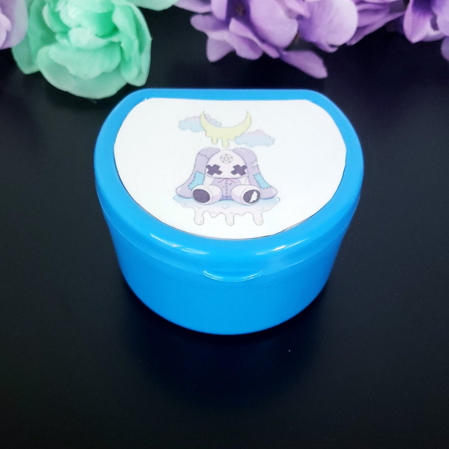 Dark Blue ABDL pacifier case featuring a creepy kawaii purple bunny with dripping moon and pastel clouds