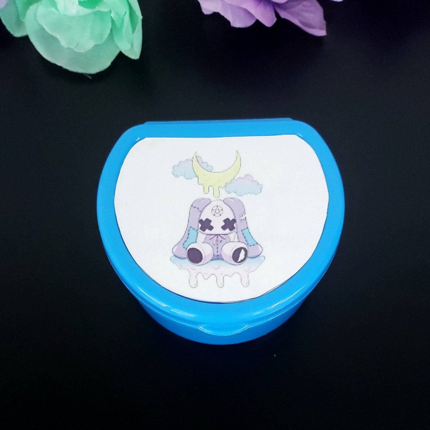 Dark Blue ABDL pacifier case featuring a creepy kawaii purple bunny with dripping moon and pastel clouds