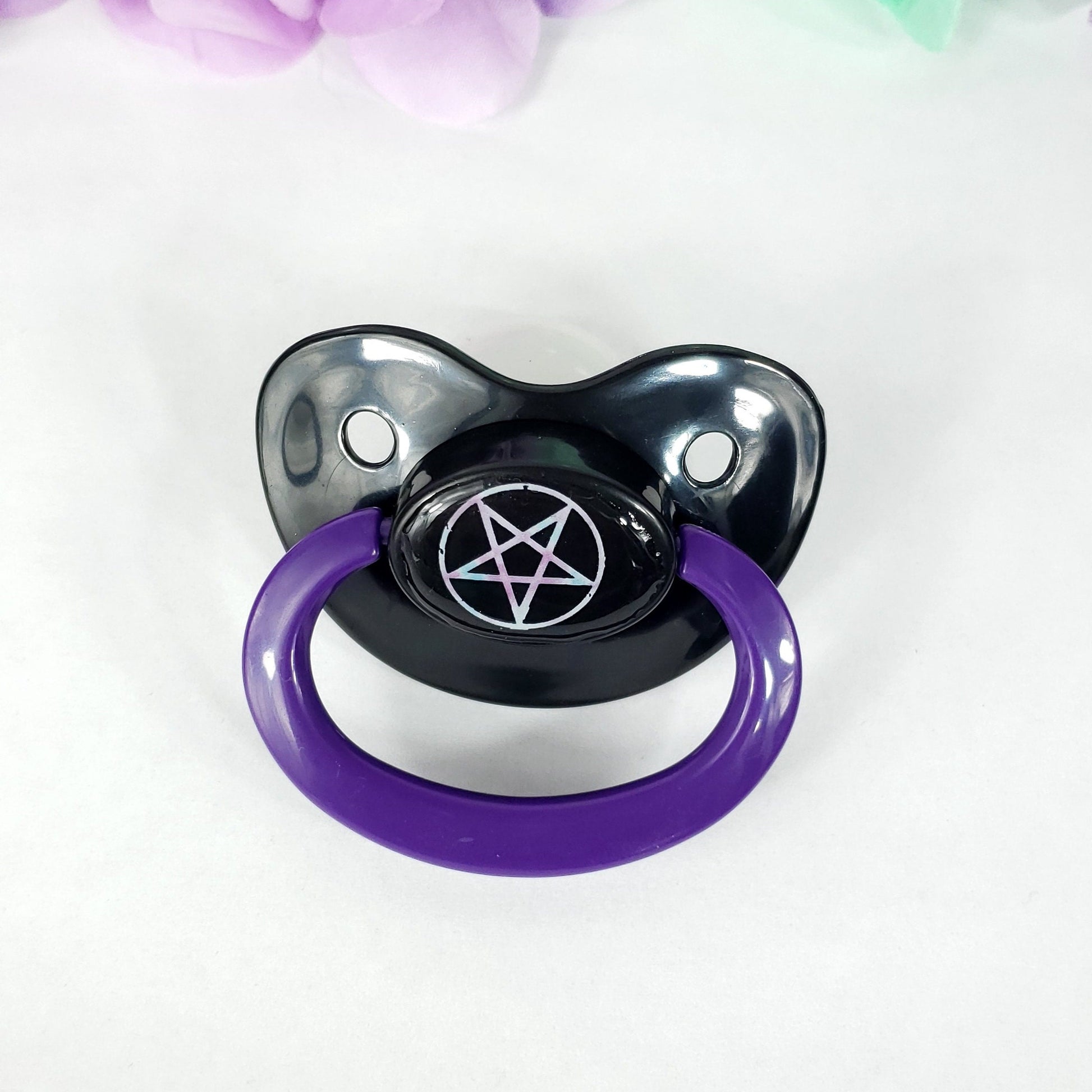 adult dummy pacifier with pastel pentagram image on the center button