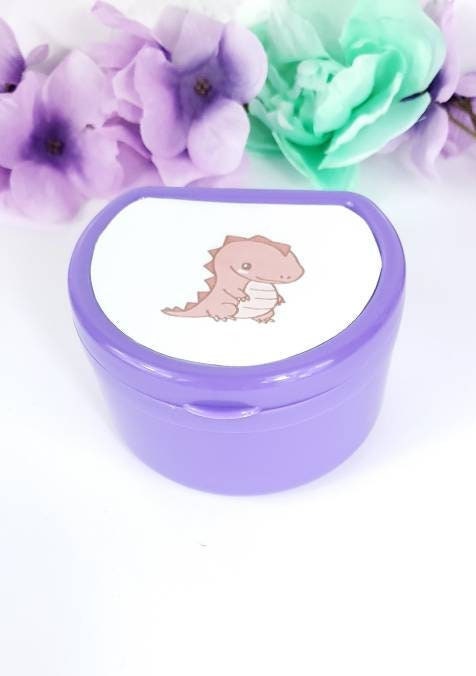 ABDL pacifier case featuring a cute red dinosaur design on the lid, adding a fun and playful touch to pacifier storage.