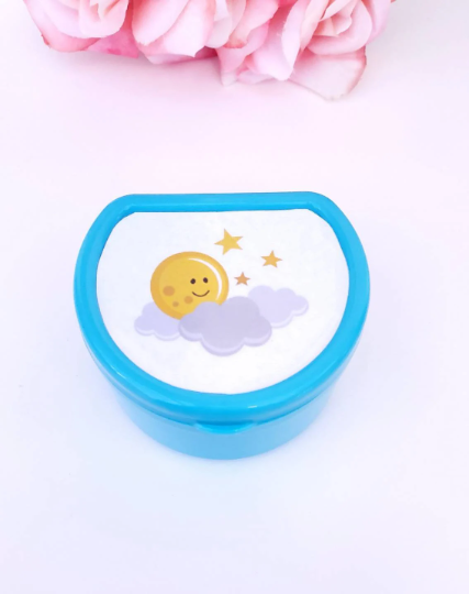 ABDL pacifier case featuring a stars and moon design on the lid, adding a dreamy and celestial touch to pacifier storage.