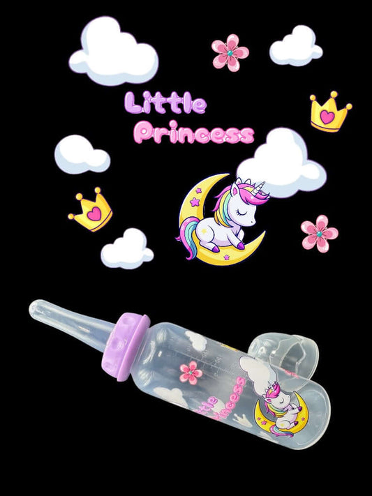 Side view of ABDL bottle with pastel artwork and long silicone nipple. Showing up close full design of unicorn on moon, text little princess with clouds, crowns, and flowers
