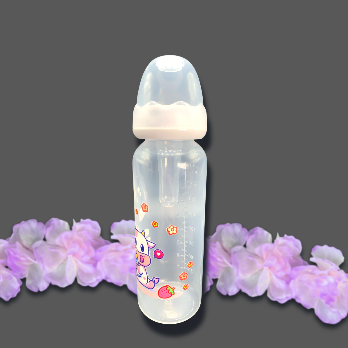 An 8oz adult baby bottle featuring a cute strawberry cow theme, with a playful pink cow, flowers, and strawberries wrapped around the bottle, creating an adorable and sweet design.