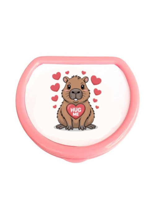 pink pacifier storage case with capybara on it with red hearts and a center heart that reads Hug Me
