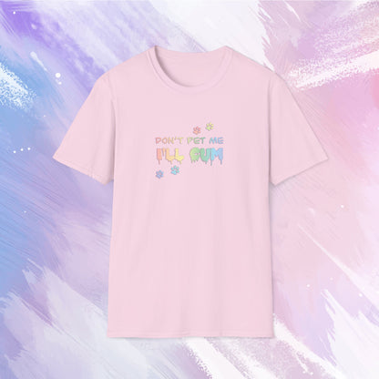 T-shirt featuring text saying "Don't pet me, I'll cum" in rainbow text with cute paw prints going across the text.