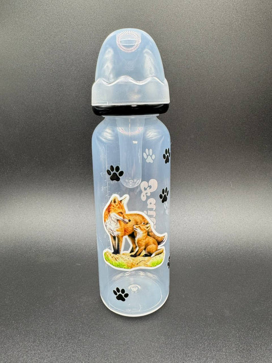 Clear adult baby bottle with fox design and paw prints on a gray background