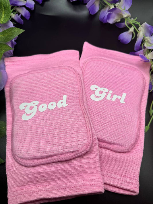 light pink knee pads with the text Good Girl 