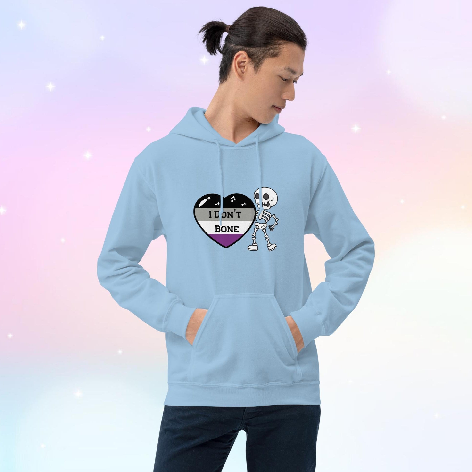 Asexual pride hoodie featuring a heart in asexual flag colors—black, gray, white, and purple—with the phrase 'I Don't Bone' in the center. A skeleton holds the heart, adding a playful yet bold design.